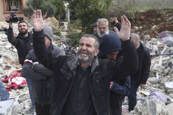 Ahmad Bazzi, pictured next to the remains of his house, which was destroyed by an Israeli airstrike in Bint Jbeil, southern Lebanon. Ahmad Bazzi is the father of Ali and Ibrahim Bazzi.