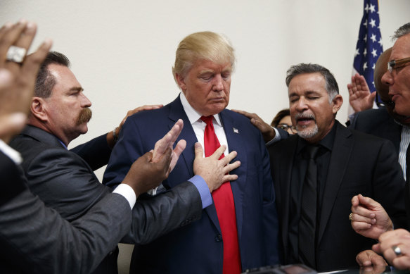 Pastors from the Las Vegas area pray with Donald Trump before his election victory in 2016.