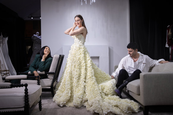 Stylist Meggy Smith, Alexandra Bourne (partner of Essendon’s Zach Merrett) and designer Con Ilio prepare for Sunday’s Brownlow Medal red carpet.