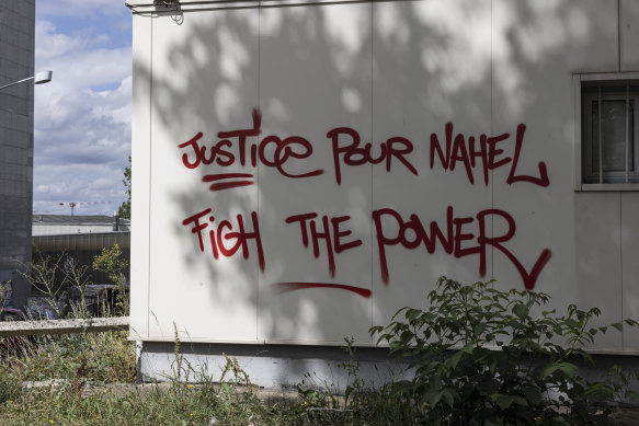 Graffiti reading Justice for Nahel is seen on a wall nearby the mosque in which his funeral prayers were held, on July 1 in Nanterre, France.