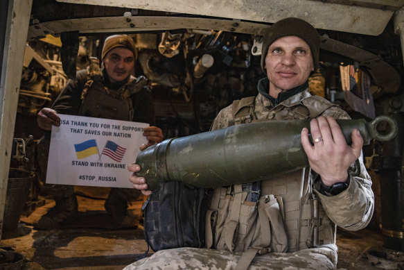 Soldiers of Ukraine’s 5th brigade hold a poster thanking the US for support at the front line near Toretsk, Donetsk region, Ukraine.