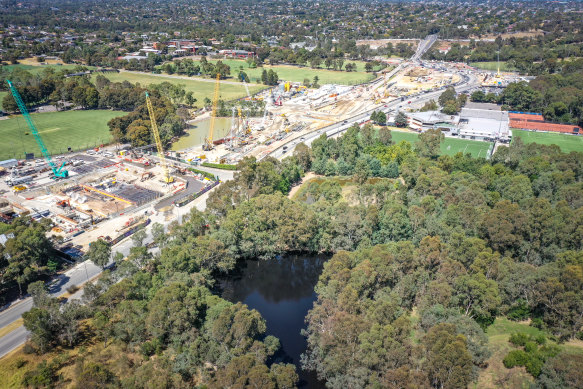 A tunnel entrance for Victoria’s $26 billion North East Link is under construction near the billabong.