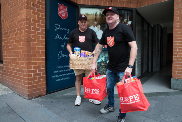 Danny Salsbury (right) has seen rising demand for meals and food hampers.