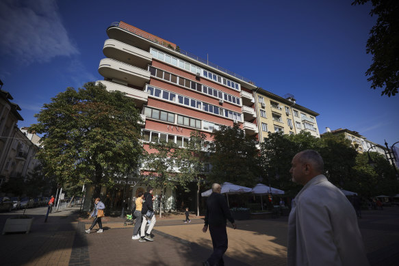 People walk past a building where the Sofia-based company Norta Global is headquartered.