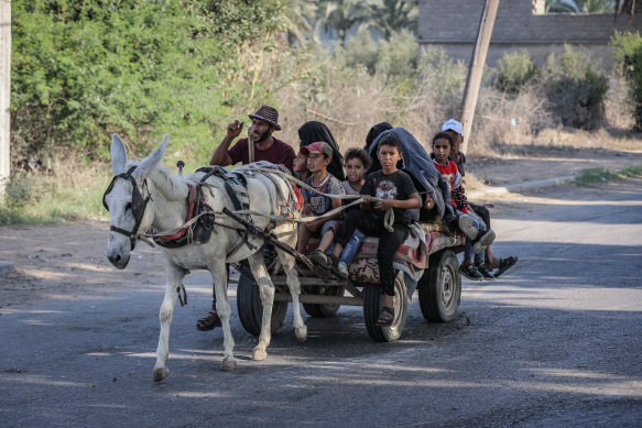 Citizens are seen trying to leave the city to reach a safer place on Friday, but it’s questionable whether anywhere in Gaza is safe.