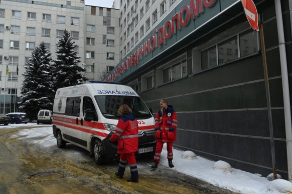 Ambulance officers outside a hospital in Kharkiv, Ukraine, in March.