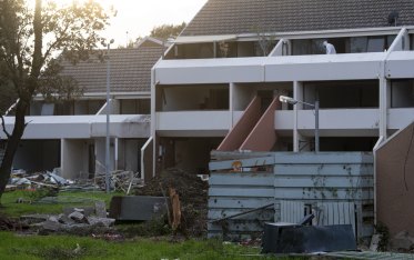 A worker in PPE at the Barak Beacon housing estate in June.