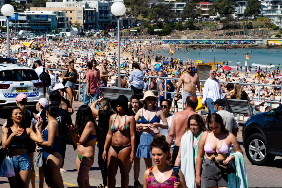 Hundreds of Sydneysiders enjoyed the sun at Bondi on Sunday as NSW recorded another day with no community COVID cases.