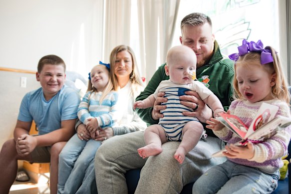 Kyle and Nicole Muldoon with baby KJ and his siblings.