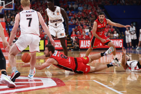Mitch Norton of the Wildcats dives onto a loose ball during the round two NBL match at RAC Arena.