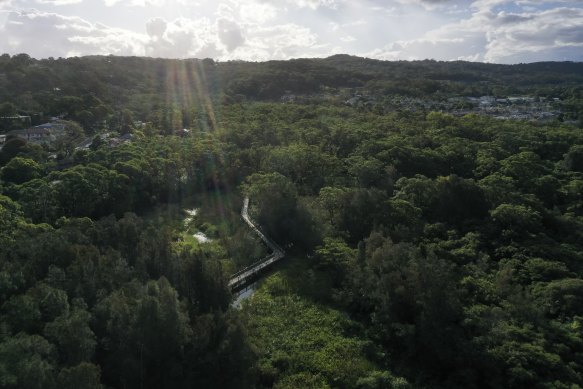 The Warriewood site backs on to wetlands, and the council and developer disagree about whether flood risk has been adequately mitigated.