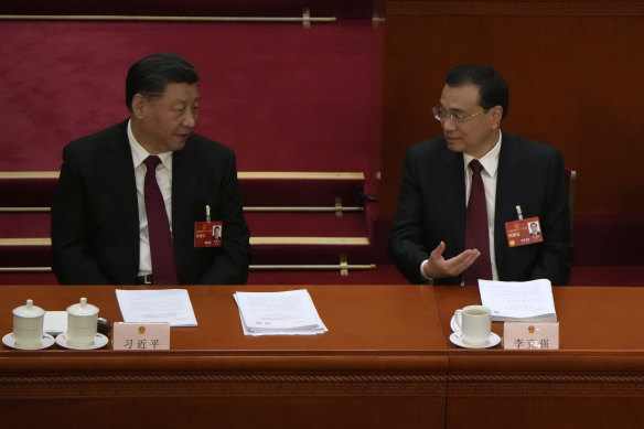 Chinese President Xi Jinping (left) and outgoing Premier Li Keqiang at the National People’s Congress in Beijing on Sunday.