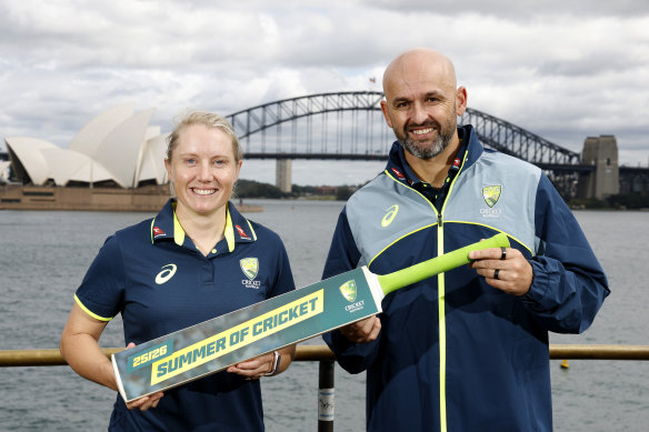Australian players Alyssa Healy and Nathan Lyon pose for a photo during the 2025/26 Cricket Australia schedule announcement