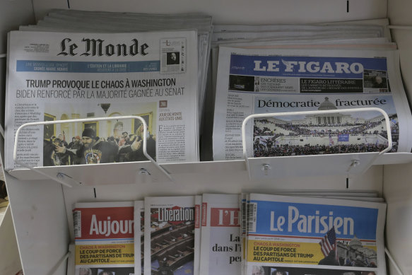 Copies of the French newspapers Le Monde, Le Figaro and others in Paris. The papers are among 121 to receive annual news payments from Google.