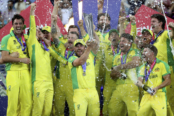 Australia’s captain Aaron Finch raises T20 World Cup trophy.