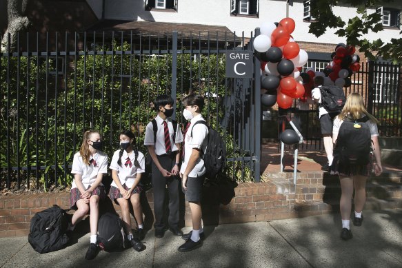 School’s back: students arrived early at Cammeryagal High School to see their friends.