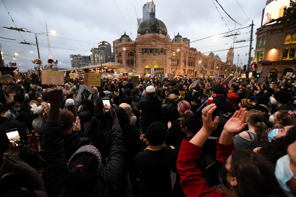 Protesters outside Flinders Station during the Black Lives Matter rally on Saturday. 