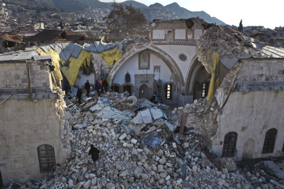 Turkish citizens check the historic Habib Najjar mosque which destroyed during the earthquake.