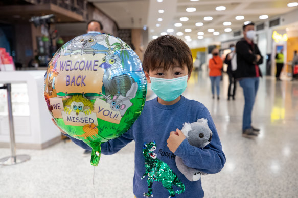 Hiro Xu, 7, holding a balloon and a koala toy given to him by Tourism Australia’s welcoming team greeting travellers flying to Australia from Singapore on Sunday. 