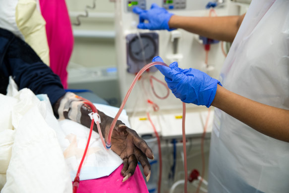 An Indigenous man undergoes dialysis treatment at The Purple House health clinic in Alice Springs.

