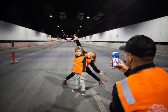 Gymea resident Dave Spears photographs son Thomas and daughter Skylah in the M4-M8 Link tunnels on Sunday.