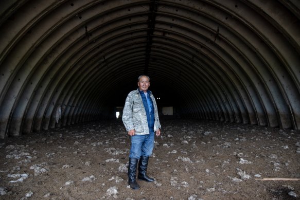 Mongolian herder Oyunbileg Dambii inside a Russian military bunker that once housed armoured vehicles.