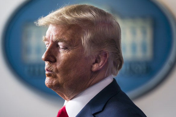 US President Donald Trump pauses during a Coronavirus Task Force news conference in the briefing room of the White House.