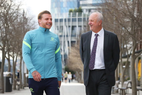 Jason Cummings with Socceroos coach Graham Arnold on Tuesday.