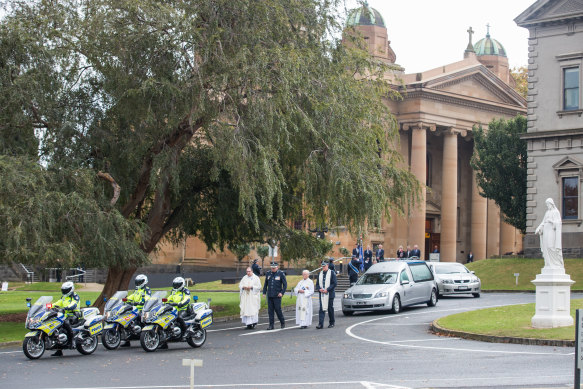 Mourners leave the chapel at Xavier following the funeral for Constable Prestney. 
