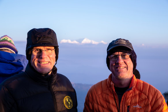 Hillary, left, and Balderstone in 2018 at dawn atop Tiger Hill near Darjeeling, India, in the eastern Himalayas. In the background: the world’s third-highest mountain, Kanchenjunga (8586 metres).