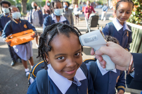 Students at St Brendan's Primary School in Flemington return to school.