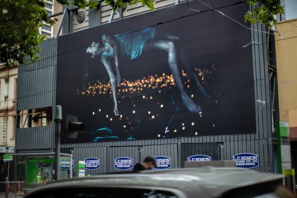 A giant billboard featuring of a girl who seems to float in the sky by Bill Henson is a highlight of the inaugural Uptown festival.