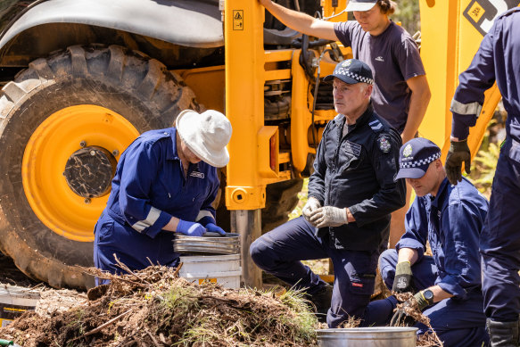 Experts dig through soil during the search for missing campers Russell Hill and Carol Clay.