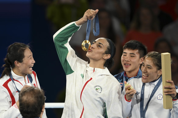 Khelif kisses the gold medal for the women’s 66kg boxing.