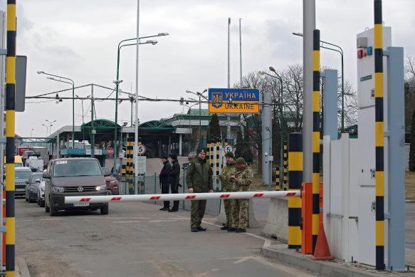 Ukrainian citizens flee the Russian aggression across the Shehyni-Medyka checkpoint at the Ukraine-Poland border.