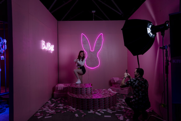 A couple take a photo in one of the themed rooms at Sexpo 