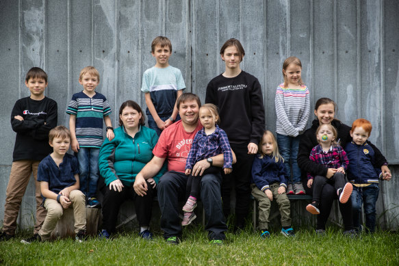 Isolated but not isolated: The family of 13: left to right, Stephen, Lachlan, Tyler, Mum Malinda, Cooper, Dad Erik holding Zoe, Andrew, Harry, Bella, Kaitlyn holding Nora, and Joel.