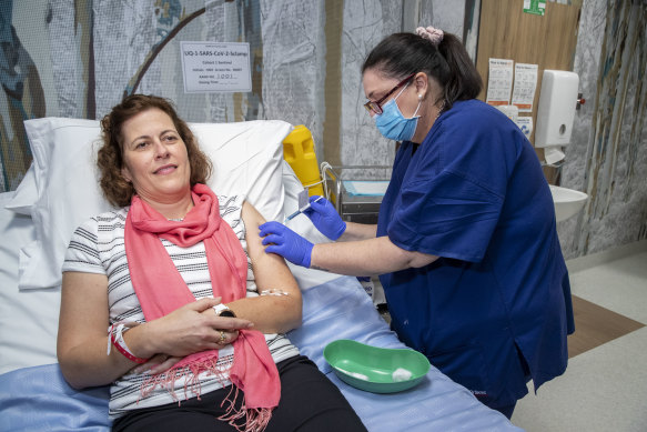 A volunteer takes part in trials of UQ's vaccine candidate in July. 