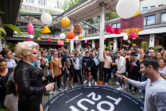 Crowds have also flocked to play Two-Up at pubs across the city, including at the Bank Hotel in Newtown