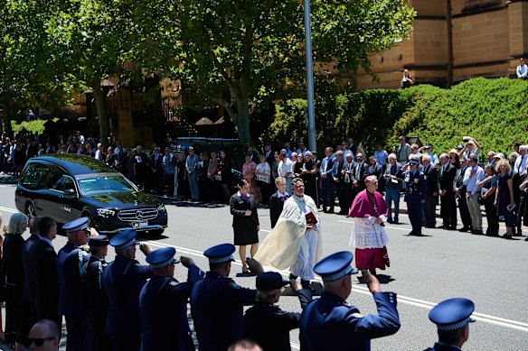 Mourners line the streets at the funeral of Peter Meagher.