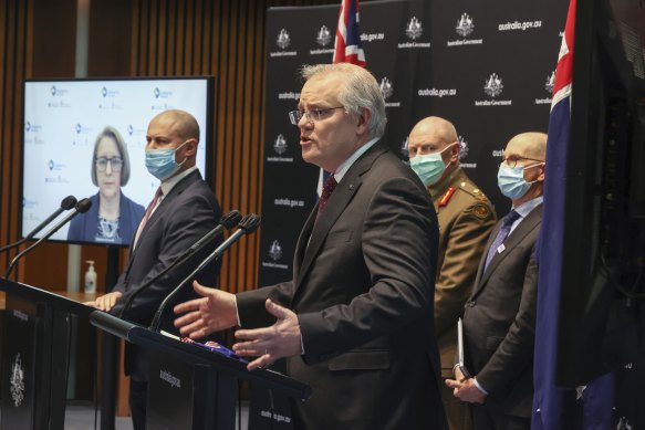 Professor Jodie McVernon from the Doherty Institute, Treasurer Josh Frydenberg, Prime Minister Scott Morrison, COVID-19 Taskforce Commander and Lieutenant General John Frewen during a press conference at Parliament House.