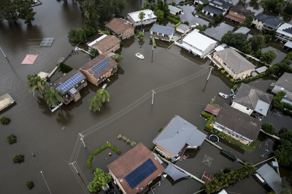 Heavy flooding in Mawson Place, Pitt Town. Water reached the first level in every house on the street in 2022.