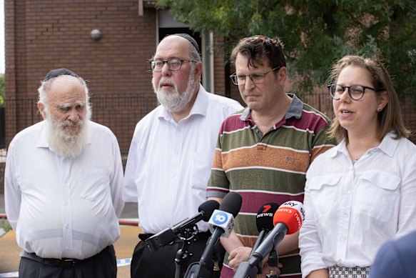 From left: Yossi Aron, Binyomin Klein, Daniel Aghion, KC, and Naomi Levin speak to the media after the Adass Israel synagogue fire last December.