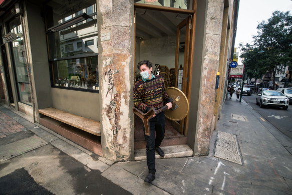 Staff at Kirks Wine Bar in the city put tables out in preparation to resume trading on June 11, 2021 in Melbourne.