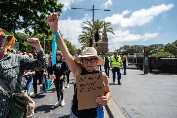 A protester outside Sydney’s St Mary’s Cathedral. 