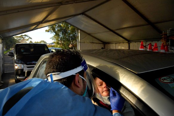Laverty Pathology staff conducting COVID-19 tests at the Roselands drive through testing clinic, earlier this month.