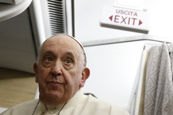 Pope Francis speaks to journalists aboard the papal flight back from Canada.