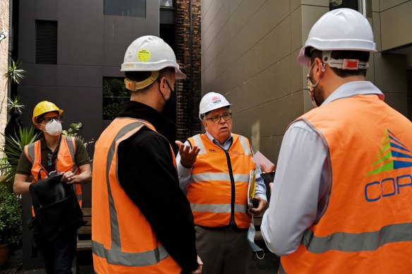 NSW Building Commissioner David Chandler (2nd from right) has announced he is resigning from his position.