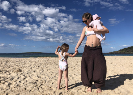 Amy Molloy, pictured with her children, suffers from GOGO – guilt of going out.