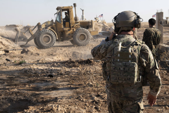 The US Army supervises the removal of military fortifications on the border of Turkey and Syria in August.